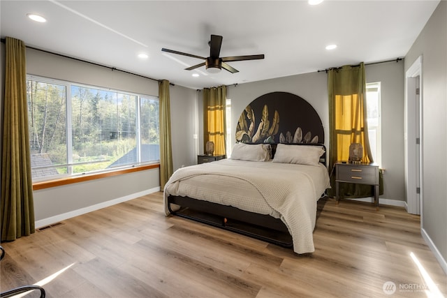 bedroom featuring baseboards, light wood finished floors, recessed lighting, and a ceiling fan