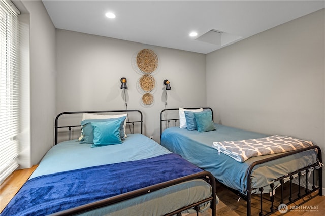 bedroom featuring wood finished floors and recessed lighting