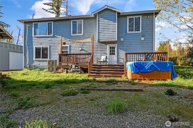 rear view of house with a wooden deck