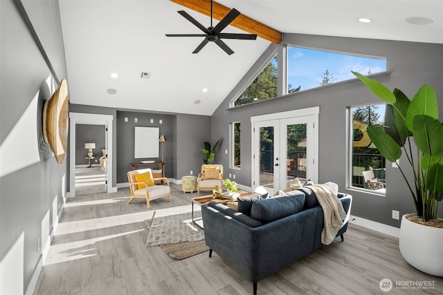 9371 Willamette Meridian Rd NW, Silverdale, WA 98383 - living room with beam ceiling, high vaulted ceiling, wood finished floors, a ceiling fan, and french doors