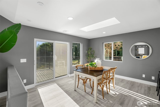 9371 Willamette Meridian Rd NW, Silverdale, WA 98383 - dining area with a skylight, baseboards, light wood-style flooring, and recessed lighting