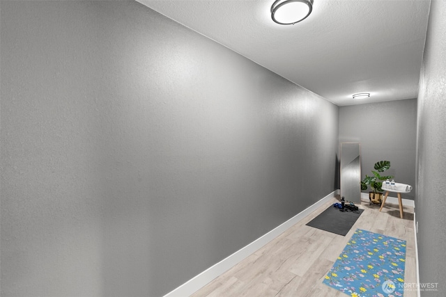 9371 Willamette Meridian Rd NW, Silverdale, WA 98383 - workout room featuring light wood finished floors and baseboards