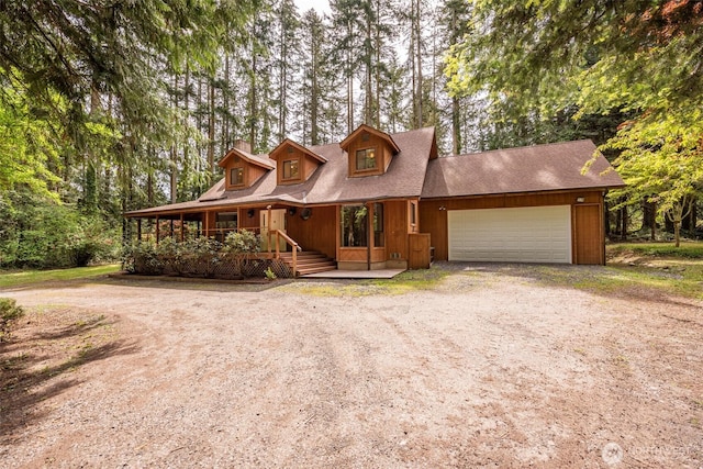 377 Stellar Ridge Ln, Sequim, WA 98382 - chalet / cabin with driveway, an attached garage, and a porch