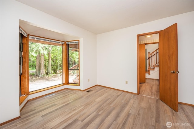 377 Stellar Ridge Ln, Sequim, WA 98382 - unfurnished room featuring wood finished floors, baseboards, and stairs