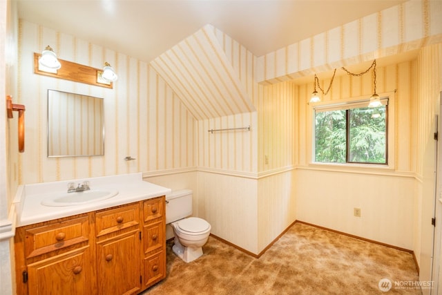 377 Stellar Ridge Ln, Sequim, WA 98382 - bathroom with wallpapered walls, toilet, vanity, and baseboards