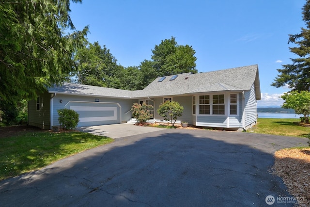 2847 Viewmont Pl, Camano Island, WA 98282 - ranch-style house featuring driveway, a garage, a front lawn, and a water view