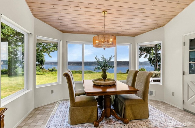 2847 Viewmont Pl, Camano Island, WA 98282 - sunroom / solarium with a chandelier, a water view, and vaulted ceiling