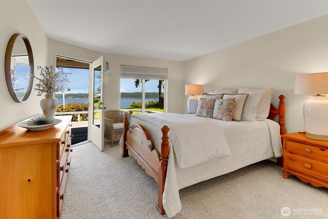 2847 Viewmont Pl, Camano Island, WA 98282 - bedroom with access to outside, light colored carpet, and a water view