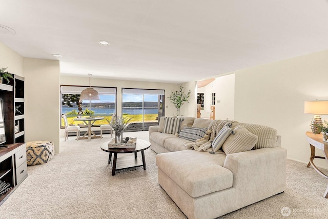 2847 Viewmont Pl, Camano Island, WA 98282 - living area with light colored carpet, a water view, and recessed lighting