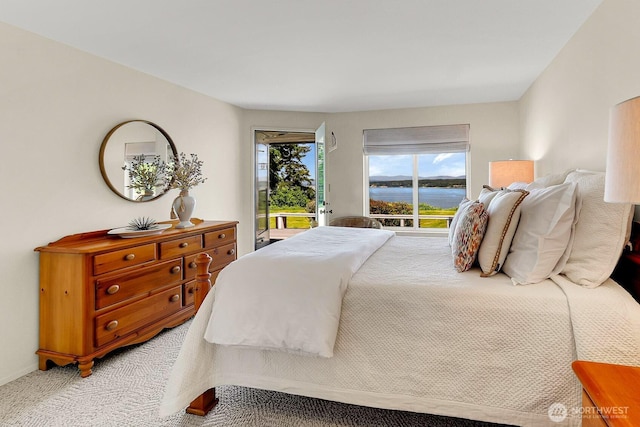 2847 Viewmont Pl, Camano Island, WA 98282 - bedroom featuring access to outside, light carpet, and a water view