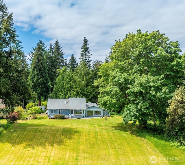 2847 Viewmont Pl, Camano Island, WA 98282 - rear view of house featuring a lawn and a view of trees