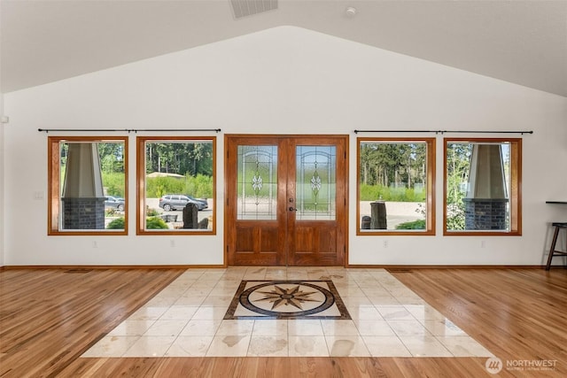 139 Coulson Rd, Chehalis, WA 98532 - entryway featuring french doors, wood finished floors, high vaulted ceiling, and baseboards