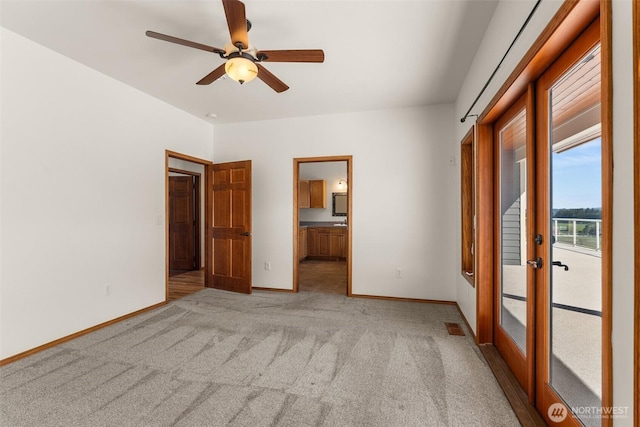 139 Coulson Rd, Chehalis, WA 98532 - unfurnished bedroom featuring light carpet, baseboards, ensuite bath, french doors, and ceiling fan