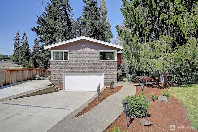 8612 NE 133rd St, Kirkland, WA 98034 - view of front facade with stairs, driveway, a garage, and brick siding