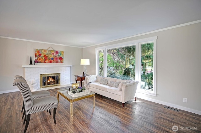 8612 NE 133rd St, Kirkland, WA 98034 - living area with ornamental molding, baseboards, a brick fireplace, and wood finished floors