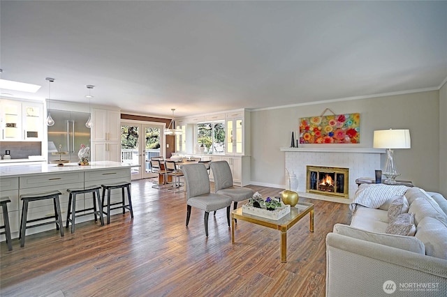 8612 NE 133rd St, Kirkland, WA 98034 - living room featuring ornamental molding, dark wood-style flooring, a fireplace, and baseboards
