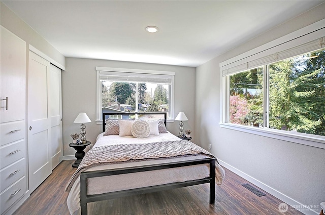 8612 NE 133rd St, Kirkland, WA 98034 - bedroom featuring dark wood-style floors, a closet, recessed lighting, and baseboards