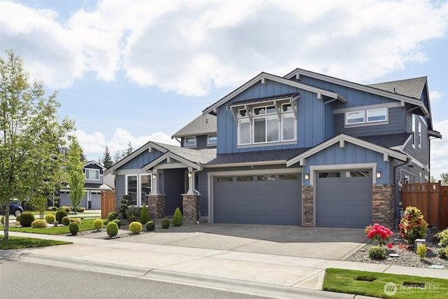 14651 Crestwood Pl E, Bonney Lake, WA 98391 - craftsman house featuring board and batten siding, a shingled roof, an attached garage, and stone siding
