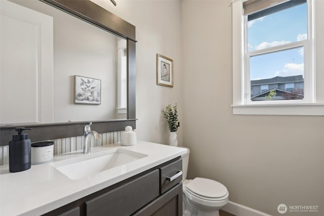 14651 Crestwood Pl E, Bonney Lake, WA 98391 - bathroom featuring toilet, vanity, and baseboards