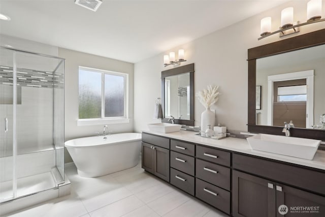 14651 Crestwood Pl E, Bonney Lake, WA 98391 - bathroom featuring a stall shower, double vanity, and healthy amount of natural light