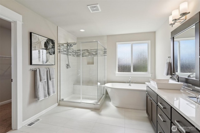 14651 Crestwood Pl E, Bonney Lake, WA 98391 - full bathroom featuring vanity, a stall shower, healthy amount of natural light, baseboards, and recessed lighting