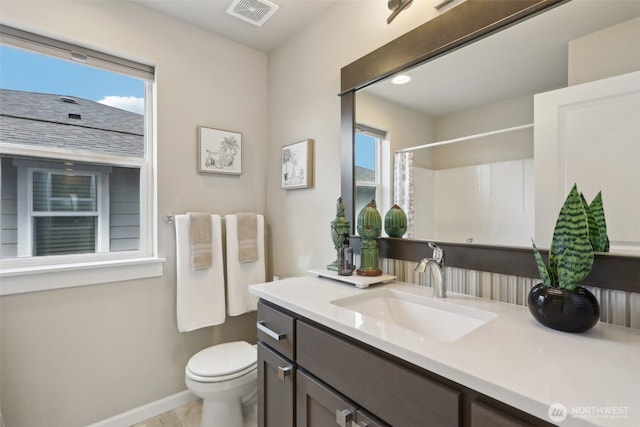 14651 Crestwood Pl E, Bonney Lake, WA 98391 - bathroom with baseboards, toilet, vanity, and a shower with shower curtain