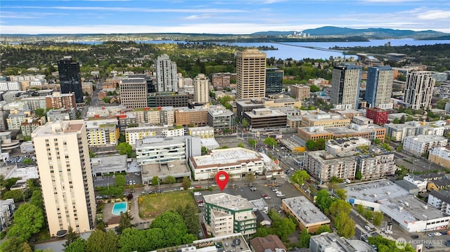 view of urban area featuring a water and mountain view