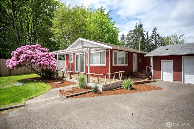 2622 Scotlac Ct SW, Olympia, WA 98512 - view of front of property with fence, an outbuilding, and a wooden deck