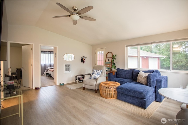 2622 Scotlac Ct SW, Olympia, WA 98512 - living area with wood finished floors, plenty of natural light, vaulted ceiling, a ceiling fan, and baseboards