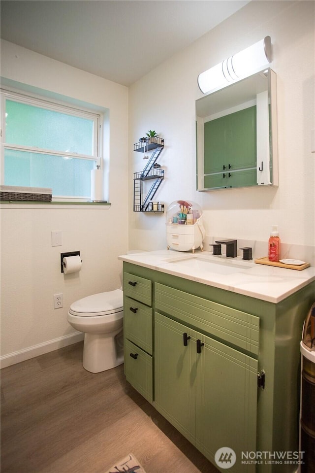 2622 Scotlac Ct SW, Olympia, WA 98512 - bathroom with wood finished floors, vanity, toilet, and baseboards