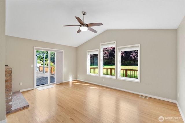10308 139th Street Ct E, Puyallup, WA 98374 - unfurnished living room with a ceiling fan, wood finished floors, lofted ceiling, and baseboards