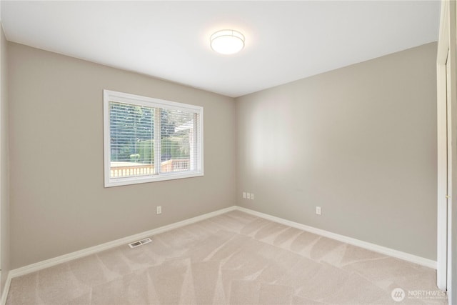 10308 139th Street Ct E, Puyallup, WA 98374 - spare room featuring light carpet and baseboards
