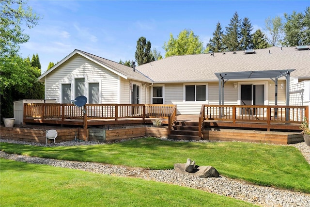 10308 139th Street Ct E, Puyallup, WA 98374 - back of house with a pergola, a wooden deck, a yard, and roof with shingles