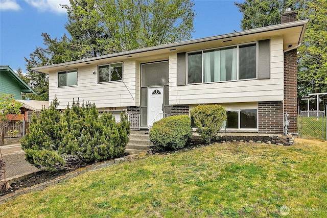 12416 SE 210th St, Kent, WA 98031 - bi-level home with a chimney and brick siding