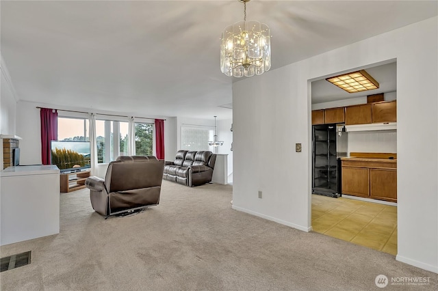 12416 SE 210th St, Kent, WA 98031 - living area featuring a chandelier, light colored carpet, baseboards, and light tile patterned floors