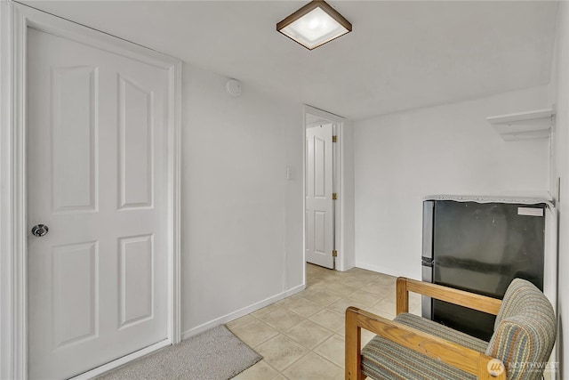 12416 SE 210th St, Kent, WA 98031 - living area featuring light tile patterned floors and baseboards