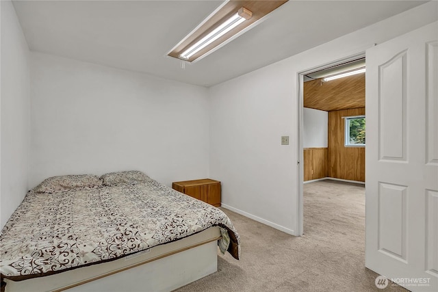 12416 SE 210th St, Kent, WA 98031 - bedroom featuring light colored carpet, baseboards, and wood walls