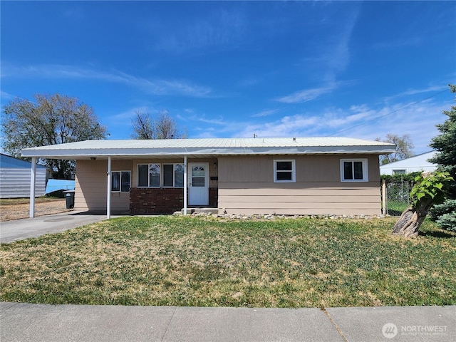 1476 W Sunset Dr, Moses Lake, WA 98837 - ranch-style house featuring metal roof, concrete driveway, and an attached carport