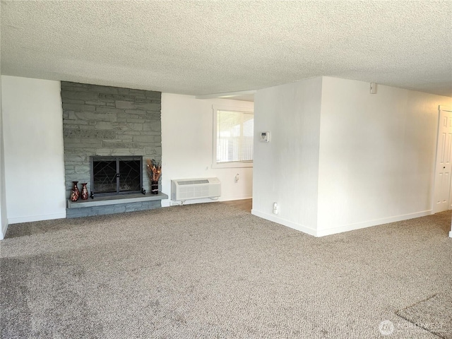 1476 W Sunset Dr, Moses Lake, WA 98837 - unfurnished living room with carpet floors, a wall mounted AC, a textured ceiling, a stone fireplace, and baseboards