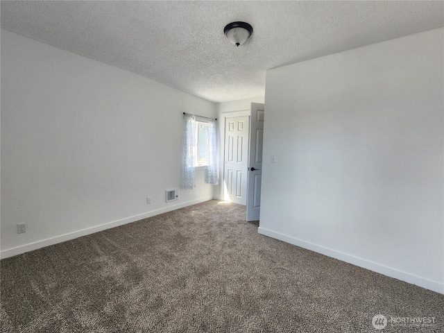 1476 W Sunset Dr, Moses Lake, WA 98837 - carpeted spare room featuring a textured ceiling and baseboards