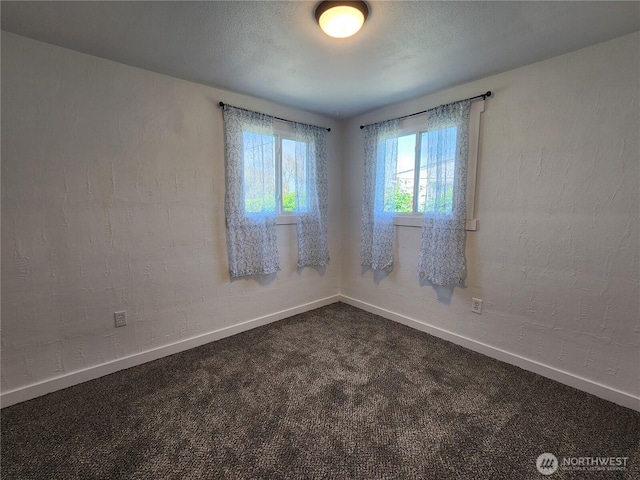 1476 W Sunset Dr, Moses Lake, WA 98837 - spare room featuring baseboards and dark carpet
