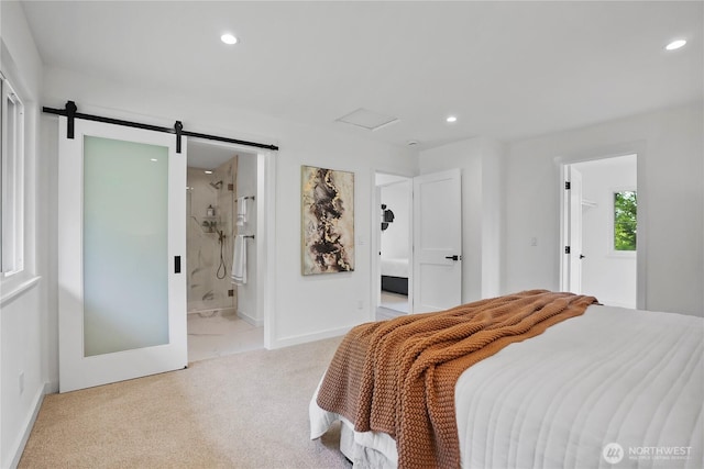 carpeted bedroom featuring recessed lighting, ensuite bathroom, a barn door, and baseboards