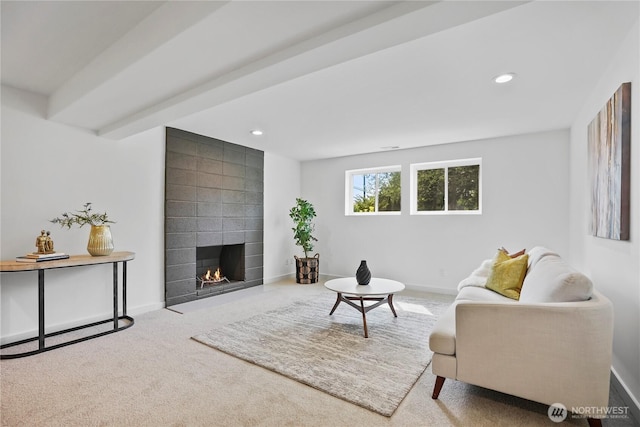 living area featuring carpet, a large fireplace, recessed lighting, and baseboards