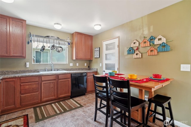 5377 Timber Ridge Dr, Mount Vernon, WA 98273 - kitchen with black dishwasher, a sink, brown cabinets, and light countertops