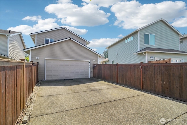 5377 Timber Ridge Dr, Mount Vernon, WA 98273 - garage featuring driveway and fence