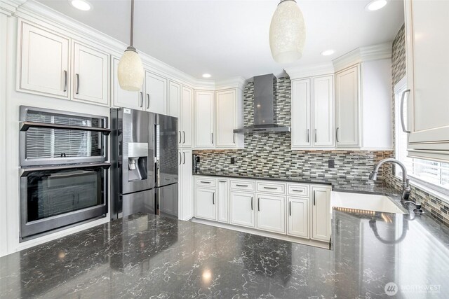 1226 57th Ct SE, Auburn, WA 98092 - kitchen featuring wall chimney range hood, stainless steel appliances, a sink, decorative backsplash, and hanging light fixtures