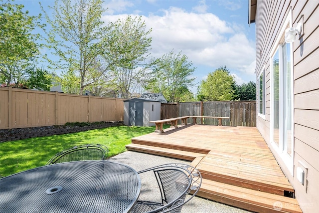 1226 57th Ct SE, Auburn, WA 98092 - wooden terrace featuring a storage shed, an outbuilding, and outdoor dining area