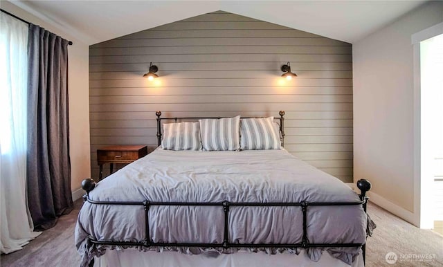 8002 172nd Pl NE, Arlington, WA 98223 - carpeted bedroom featuring lofted ceiling, wood walls, and baseboards