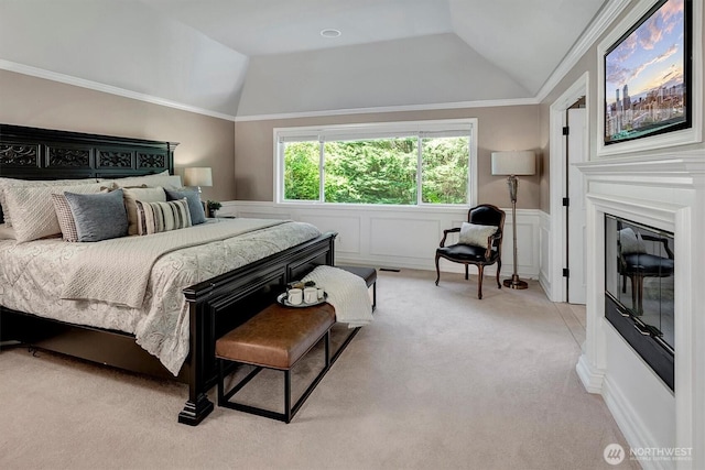 19016 NE 127th St, Redmond, WA 98052 - bedroom with vaulted ceiling, wainscoting, carpet floors, a decorative wall, and a glass covered fireplace