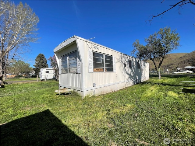 view of property exterior featuring a yard